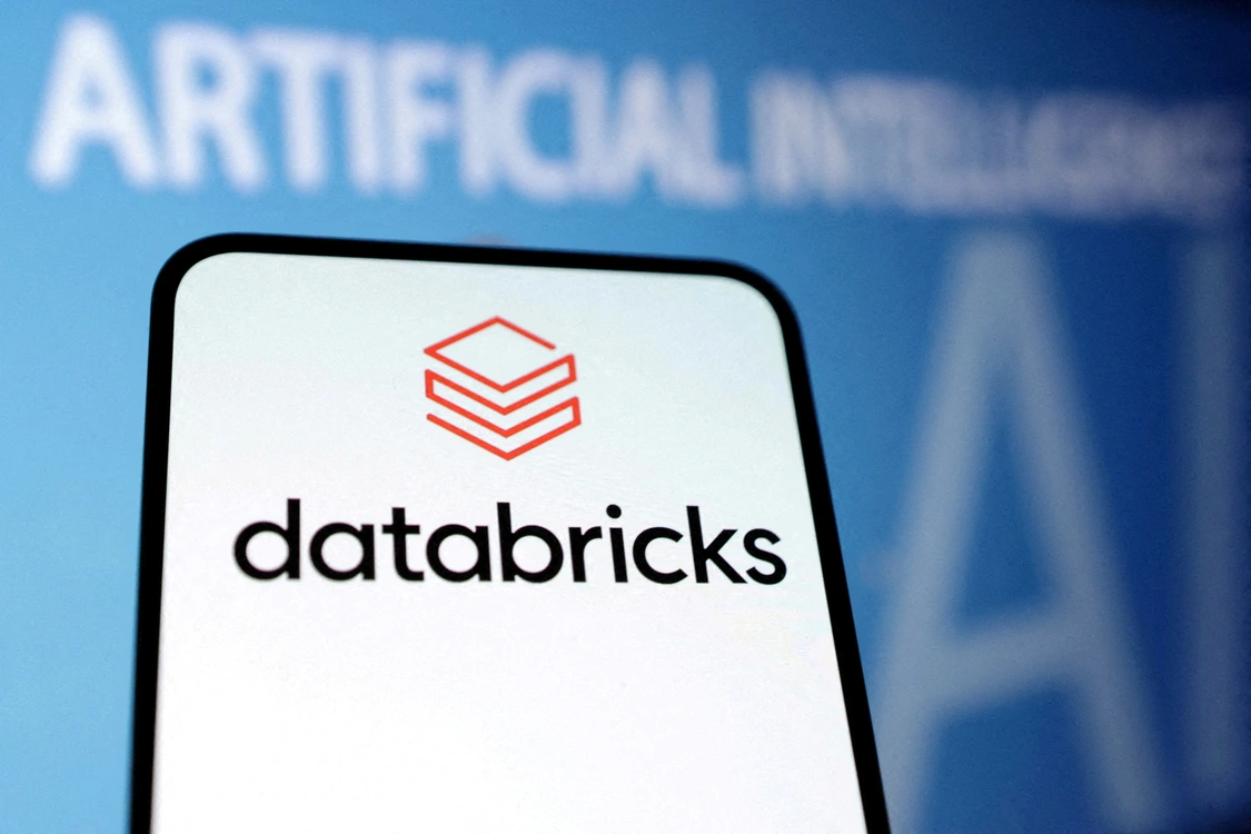 Databricks logo on a smartphone against an AI-themed background